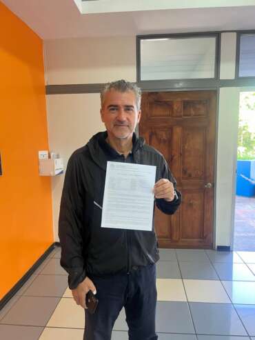 CRIE client after completing CAJA registration in Costa Rica