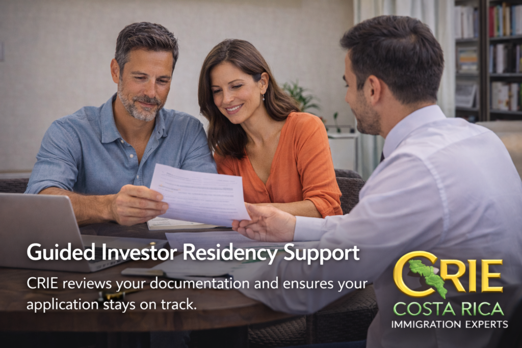 Couple meeting with an immigration consultant to review investor residency documents in a professional office setting