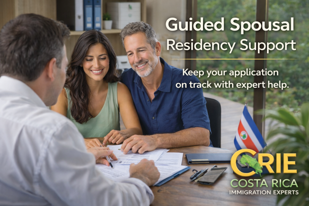 Couple meeting with an immigration consultant in a professional office to review spousal residency paperwork, with a CRIE-branded overlay