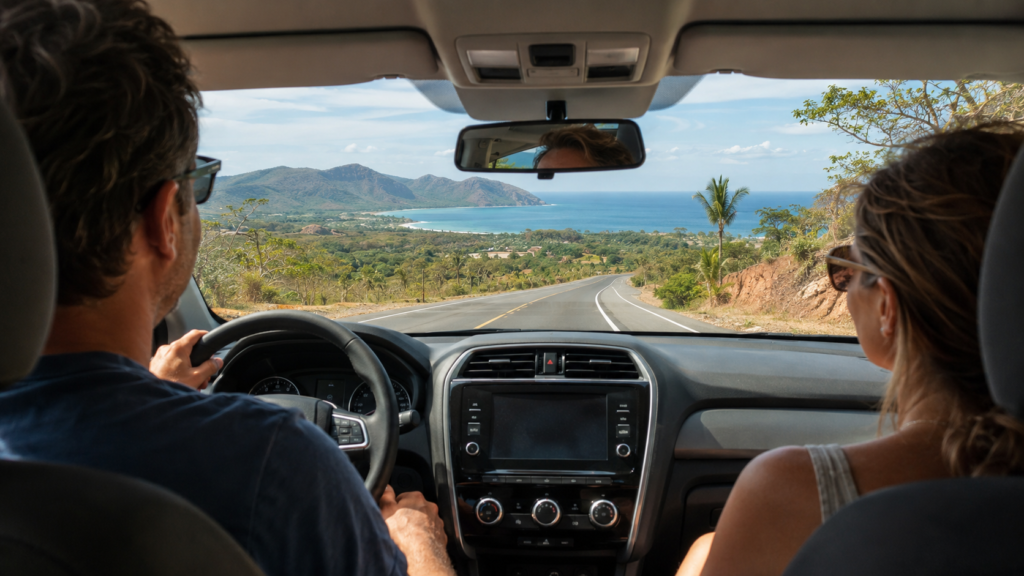 Expat couple driving from Liberia Airport toward a Guanacaste beach town in Costa Rica