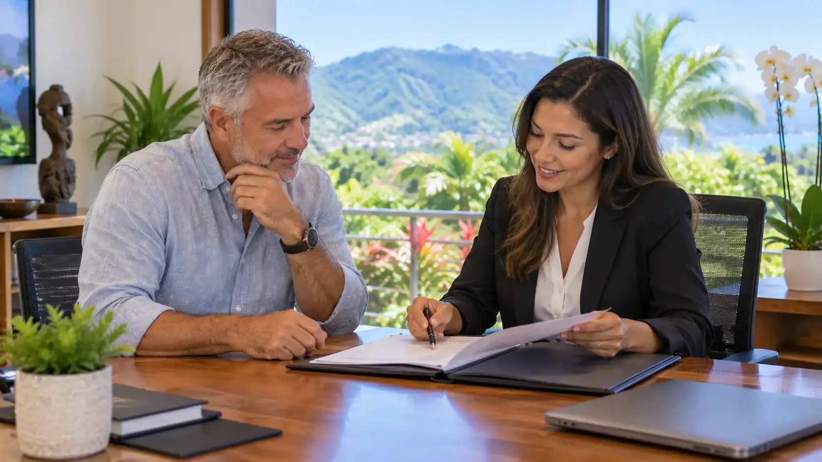 A client reviewing a file with an immigration lawyer in a bright office in Costa Rica