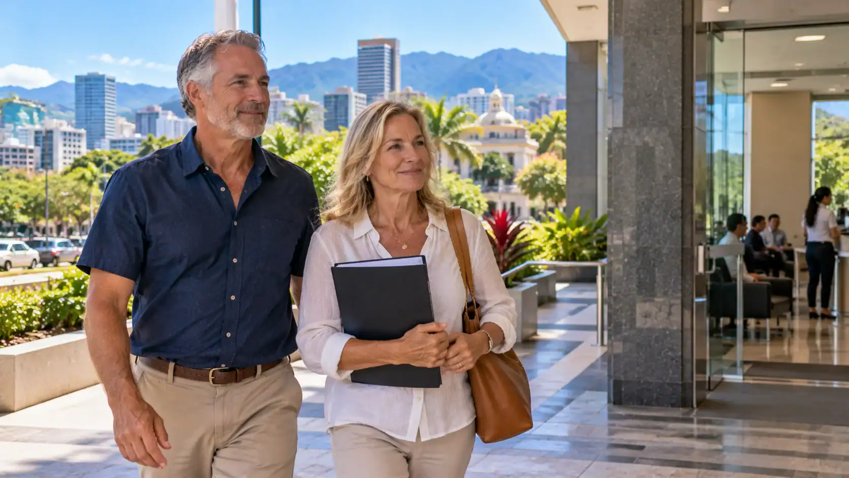 A couple arriving early with a document folder for an appointment in San José
