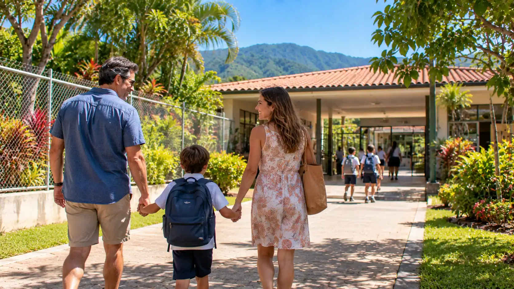 A family walking together toward a small primary school in a Costa Rican town