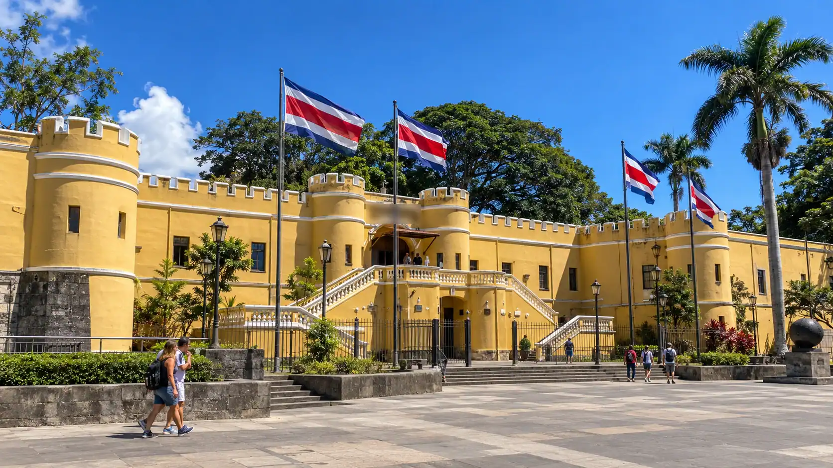 The National Museum of Costa Rica in San José, the former Bellavista Fortress, with Costa Rican flags under a blue sky