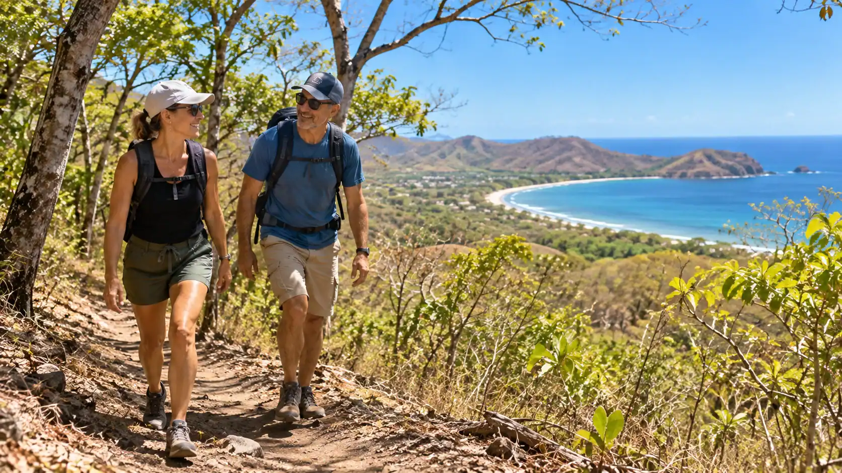 Hikers walking a trail in a dry tropical forest near Tamarindo, Costa Rica