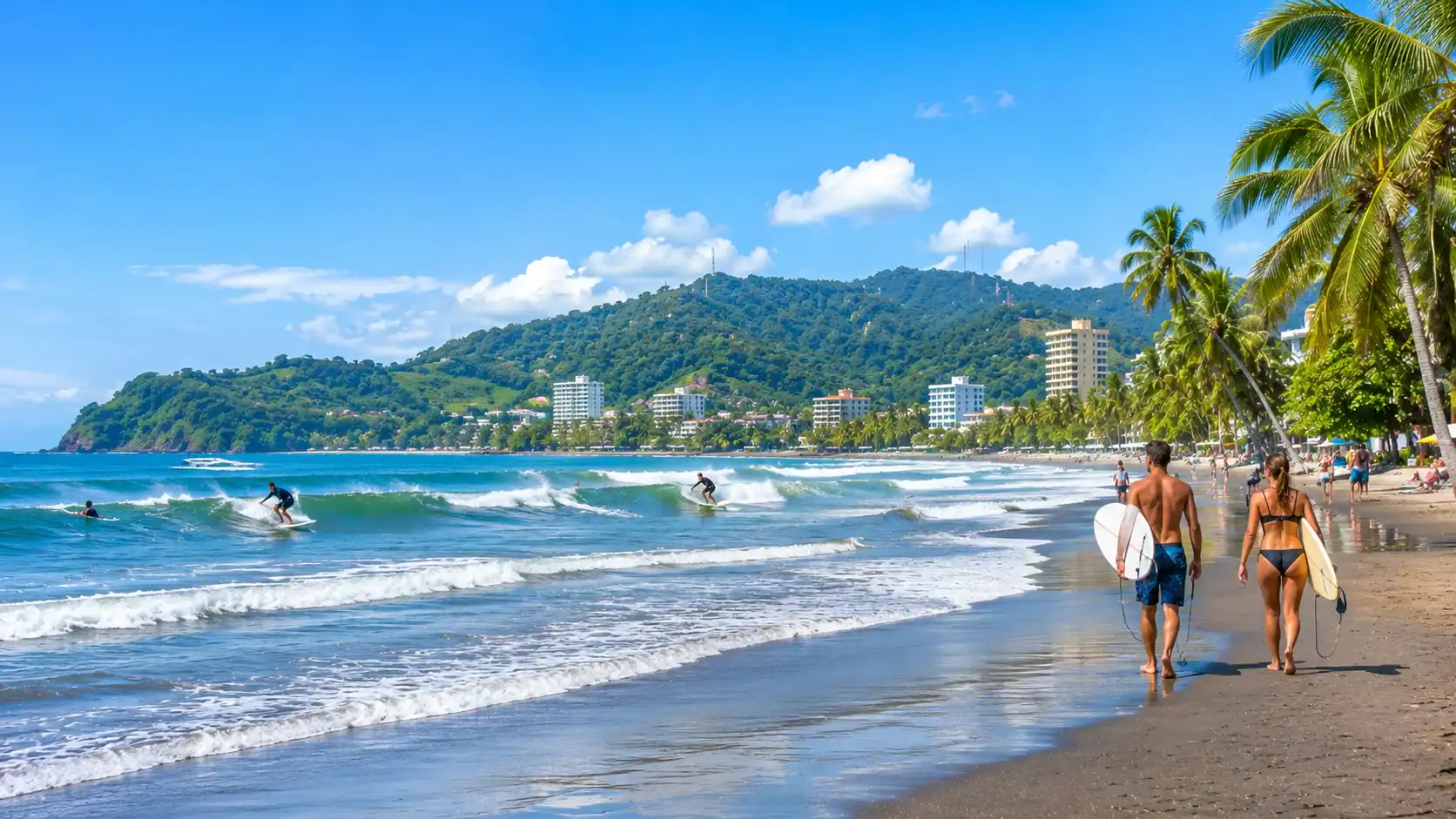 Surfers in the waves at Jaco beach on the Central Pacific coast of Costa Rica