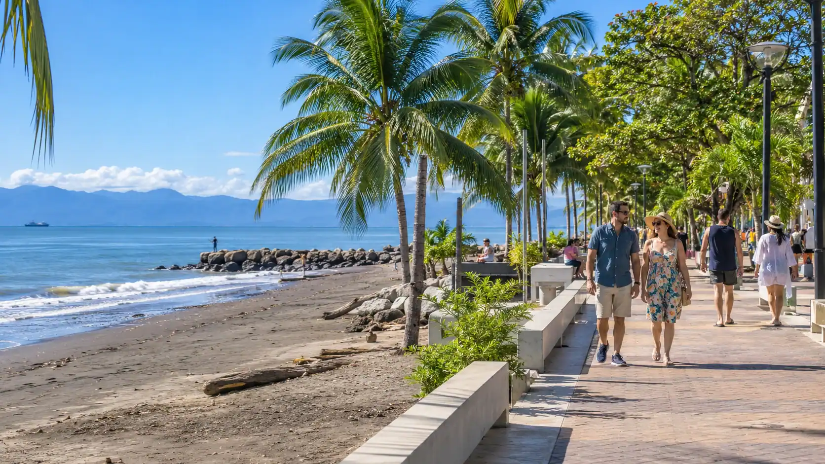 People strolling along the seaside promenade and beach in Puntarenas, Costa Rica